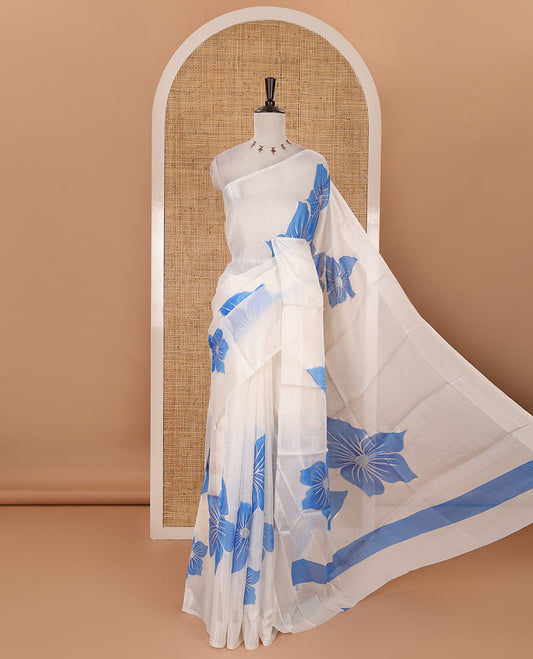 Cream floral placement-style printed Marble chiffon saree, zari border & contrast sky blue gotta patti work & mixed embroidered blouse