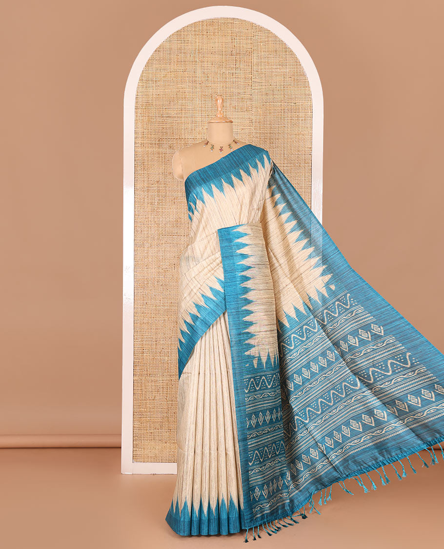 Chikku-rama green plain Khicha katan silk saree, contrast rama green temple border, ikkat printed pallu with tassels, and a contrast blouse