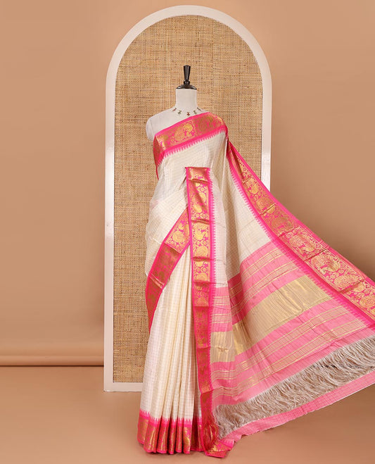 Half-white zari checked semi-taffeta silk saree, contrast rani pink annam motifs woven temple border, striped pallu & contrast striped zari border blouse