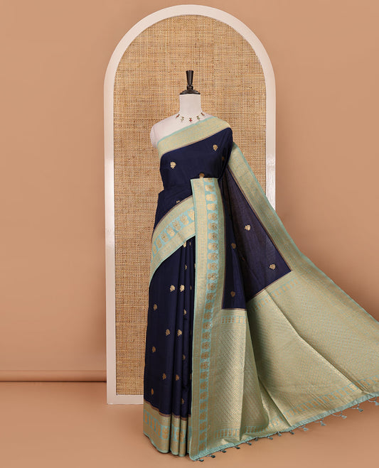 Navy blue peacock buttas dola silk saree, contrast rudraksham & iruthalai pakshi border, intricate pallu & contrast jacquard blouse