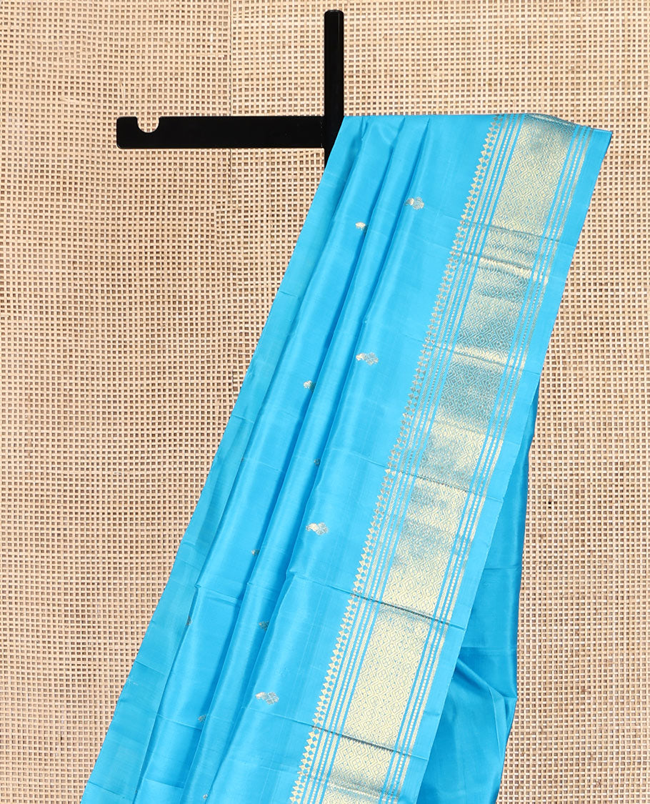 Blue Kanchipuram Silk Saree, Ornamented with Zari Buttas, Highlighted by a Zari One-Sided Border of Panner Sombu, Banaras, Muthu, and Jaal Designs, Grand Pallu, and No Blouse