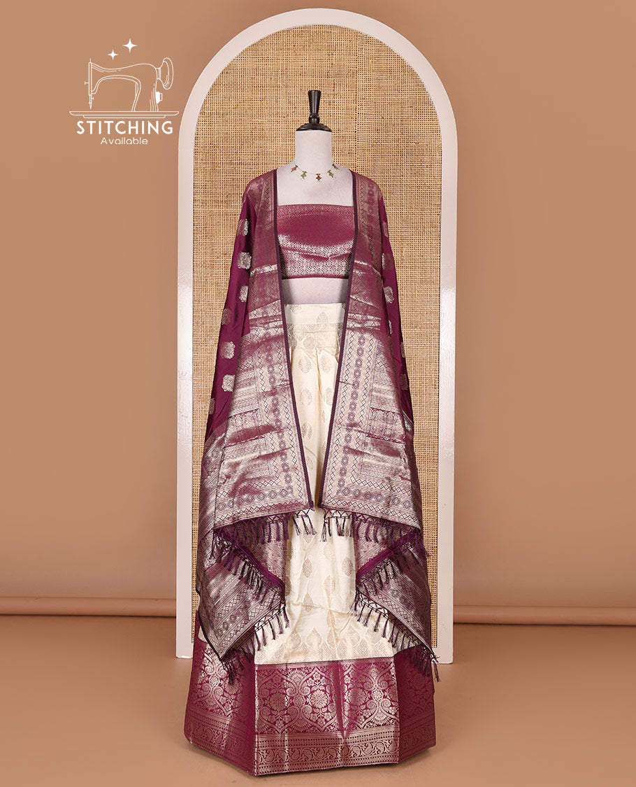 Cream with purple semi-banarasi half-saree, zari buttas with contrast traditional zari border skirt, zari jacquard blouse, and zari design dhavani