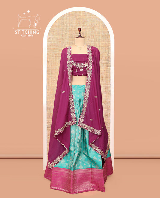 Blue Banarasi Half-Saree, Accentuated with Buttas Skirt, a Contrast Traditional Border, Contrast Embroidered Blouse, and Contrast Scallop Embroidered Dupatta
