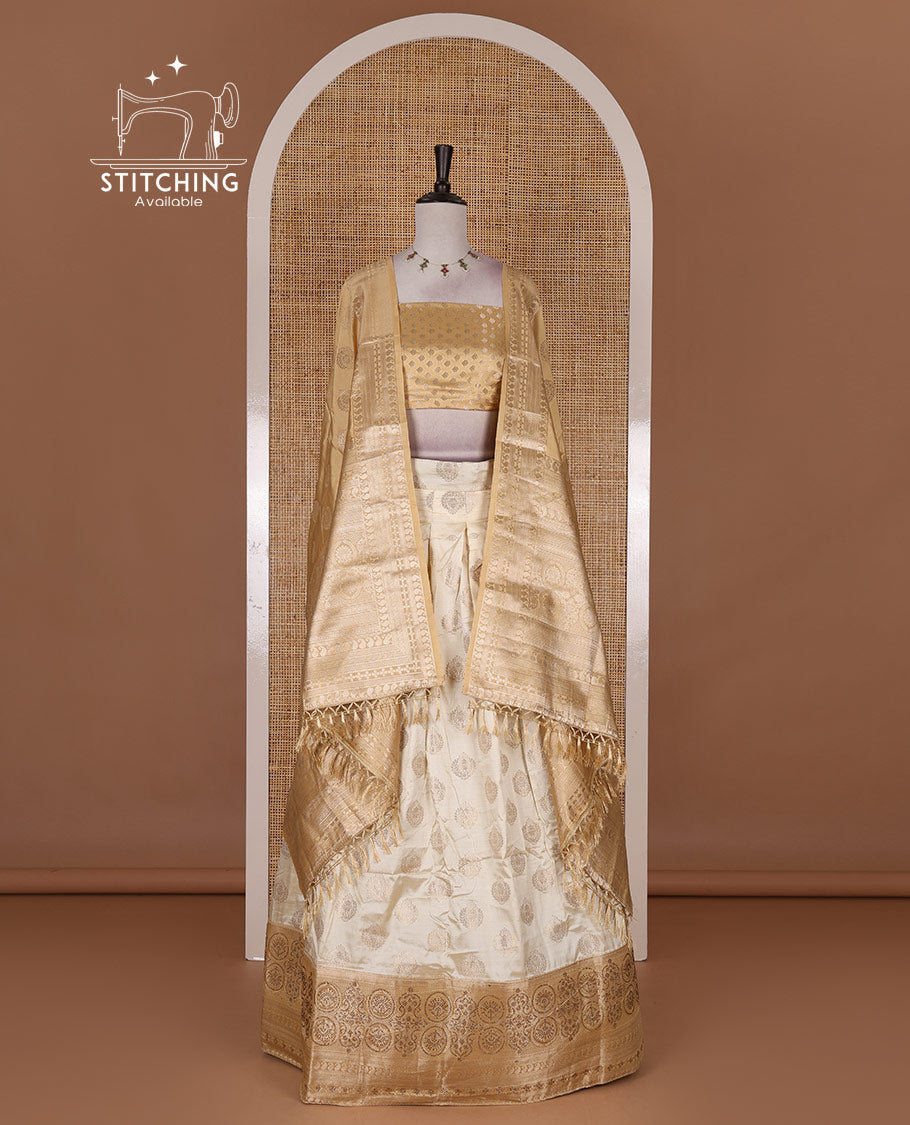 Cream and gold  semi-banarasi half-saree, zari buttas with contrast swarovski stone work border skirt, contrast zari buttas blouse, and intricate zari dhavani