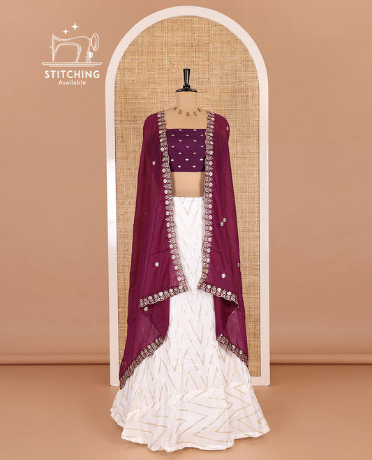 Cream-wine half-saree, gold chevron striped nylon viscose crepe skirt, contrast diamond buttas blouse, and  a contrast scallop floral-theme embroidered dhavani