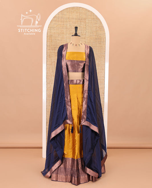 Mustard-blue taffeta half-saree, zari buttas with contrast traditional zari bordered skirt, a matching blouse, and contrast zari border dhavani with belt