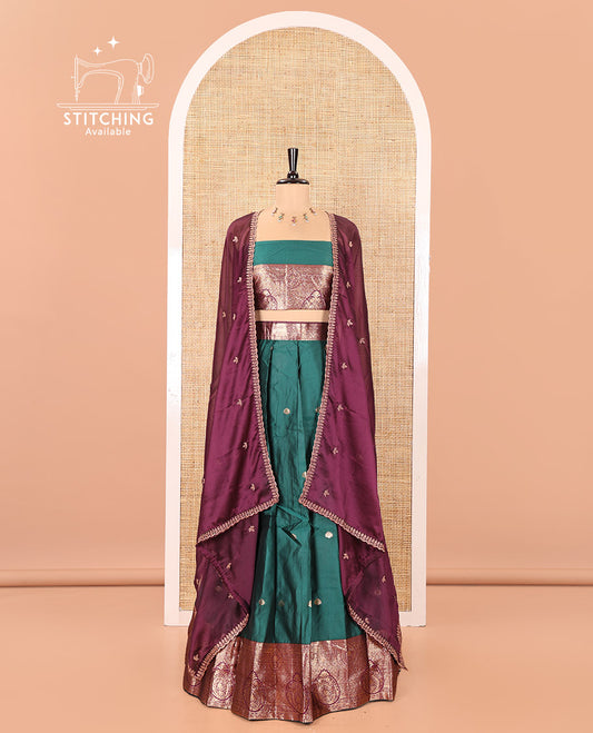 Green and Red Semi-Banarasi Half-Saree, Enriched with Zari Buttas on Its Skirt, Complemented by a Contrast Intricately Zari-Designed Border, Paired with a Matching Blouse, and a Contrast Satin Georgette Embroidered Scallop Dhavani