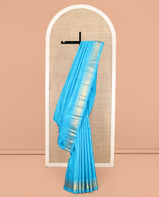Blue Kanchipuram Silk Saree, Ornamented with Zari Buttas, Highlighted by a Zari One-Sided Border of Panner Sombu, Banaras, Muthu, and Jaal Designs, Grand Pallu, and No Blouse