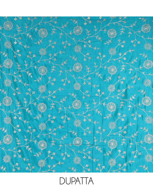 Mustard Vichitra silk material churidar set, floral motifs embroidered top, contrast Santoon bottom, and floral vine thread embroidered scallop dupatta