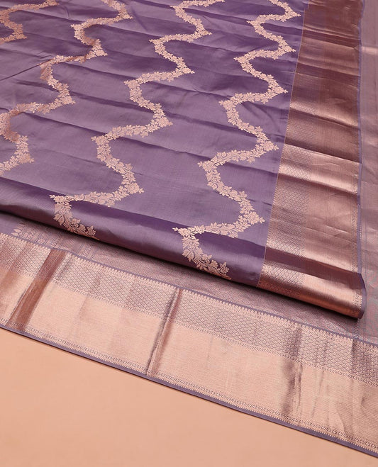 Lavender Vasundhara Silk Saree, Embellished with Floral Jaal Jacquard on Its Body, Highlighted by a Zari Border of Thilakam Mokku, Lavangam, and Jaal Designs, Grandly Woven Jaal Pallu, and Paired with a Matching Blouse