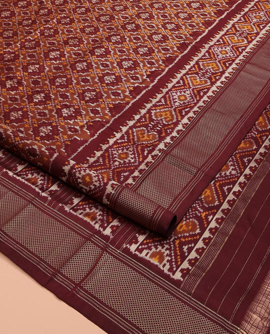 Brown Ikkat Silk Saree, Elevated with Ikkat Checks All Over Its Body, Subtle Border of Jaal Designs, Pallu of Geometric Designs, and Paired with a Matching Blouse
