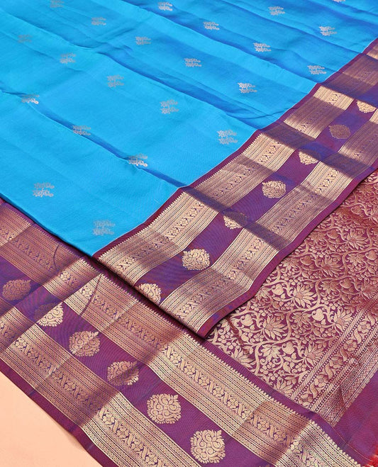 Blue Vasundhara Lite Silk Mix Saree, Elevated with Zari Buttas All Over Its Body, Complemented by a Contrast Border of Rekku, Diamond, Cross Kamalam and Zari Designs, Grand Floral Design Pallu, and Paired with a Contrast Blouse