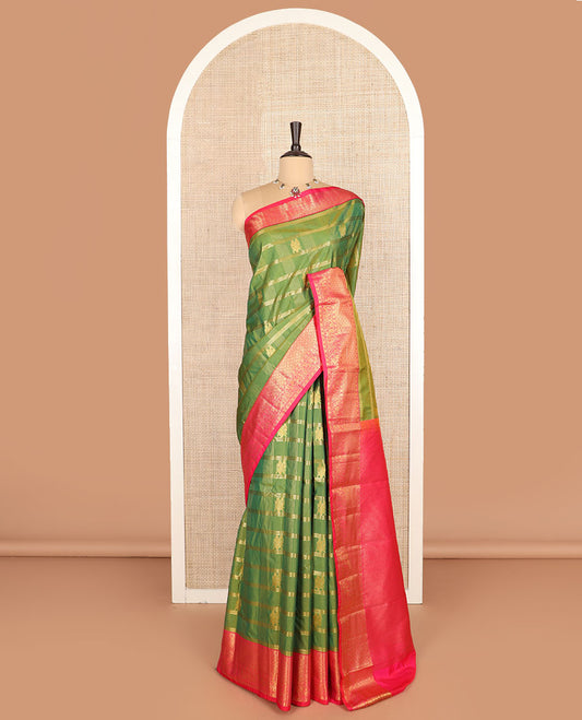 Green buttas with checked budget silk saree, contrast varisai pettu traditional zari border, and intricately woven pallu