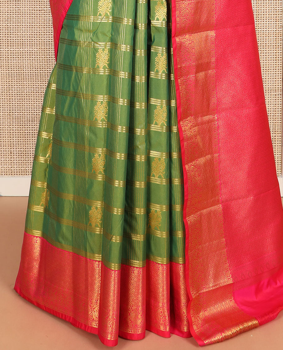 Green buttas with checked budget silk saree, contrast varisai pettu traditional zari border, and intricately woven pallu
