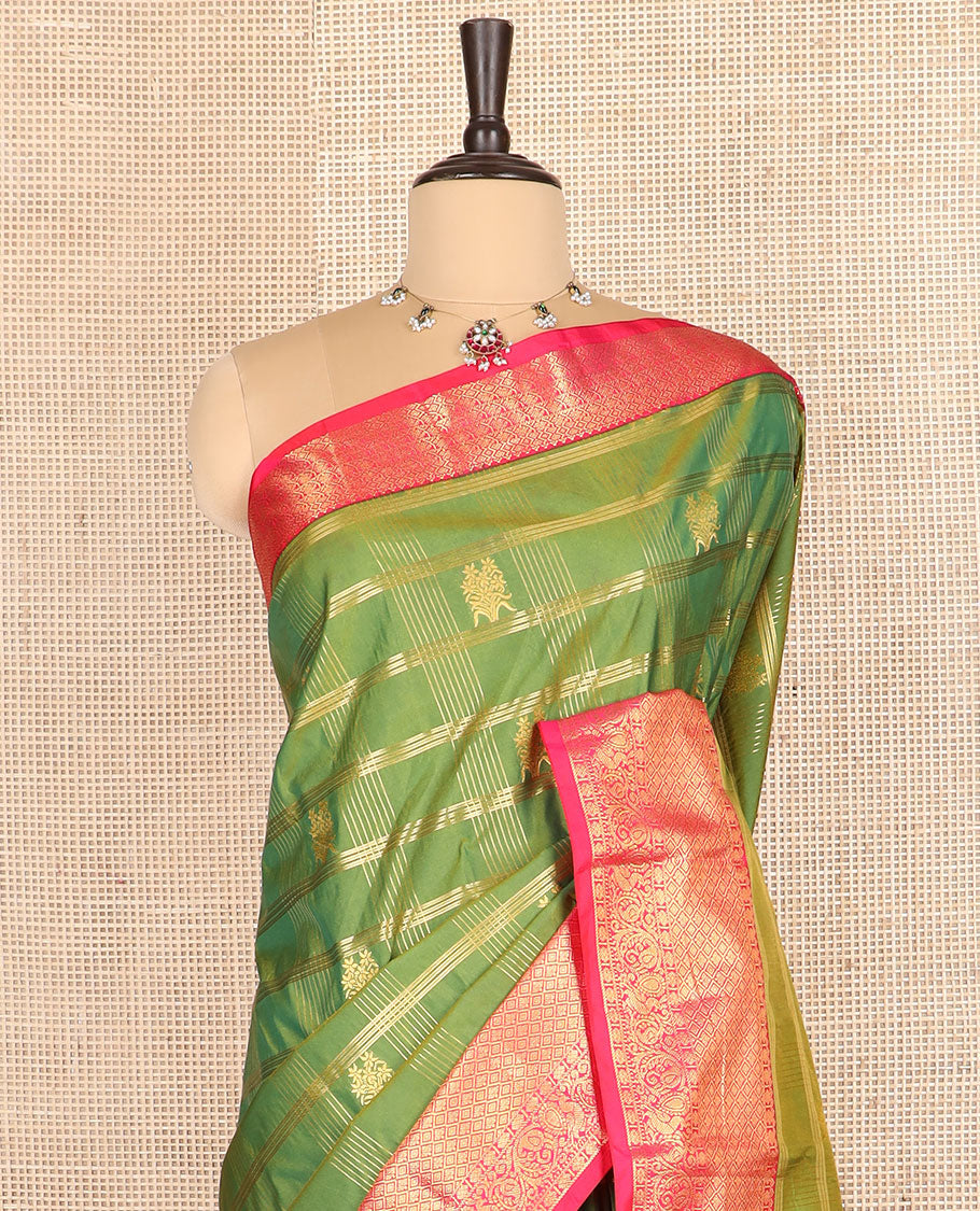 Green buttas with checked budget silk saree, contrast varisai pettu traditional zari border, and intricately woven pallu