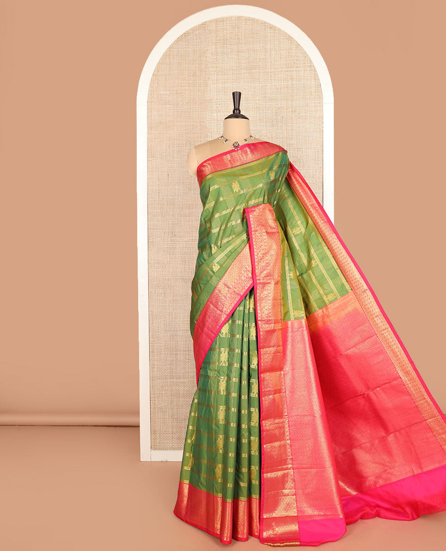 Green buttas with checked budget silk saree, contrast varisai pettu traditional zari border, and intricately woven pallu