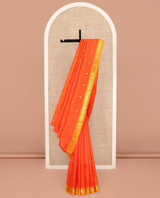 Orange Kanchipuram Silk Saree, Detailed with Zari Buttas on Its Body, Complemented by a Contrast One-Sided Border of Banaras, and Jaal Designs, Pallu Features Zari Designs, and Comes Without a Blouse