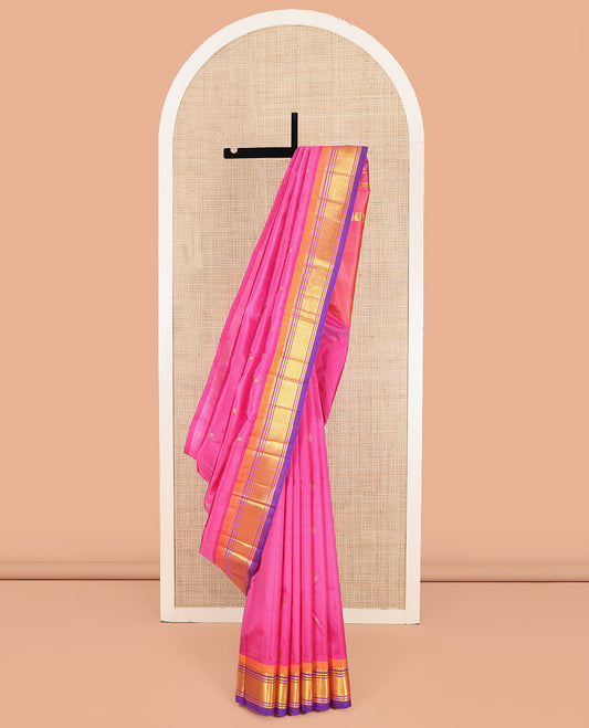 Pink Kanchipuram Silk Saree, Accentuated with Zari Buttas on Its Body, Complemented by a Contrast One-Sided Border of Panner Sombu, Banaras, and Mayil Kann Designs, Pallu of Zari Designs, and Comes Without a Blouse