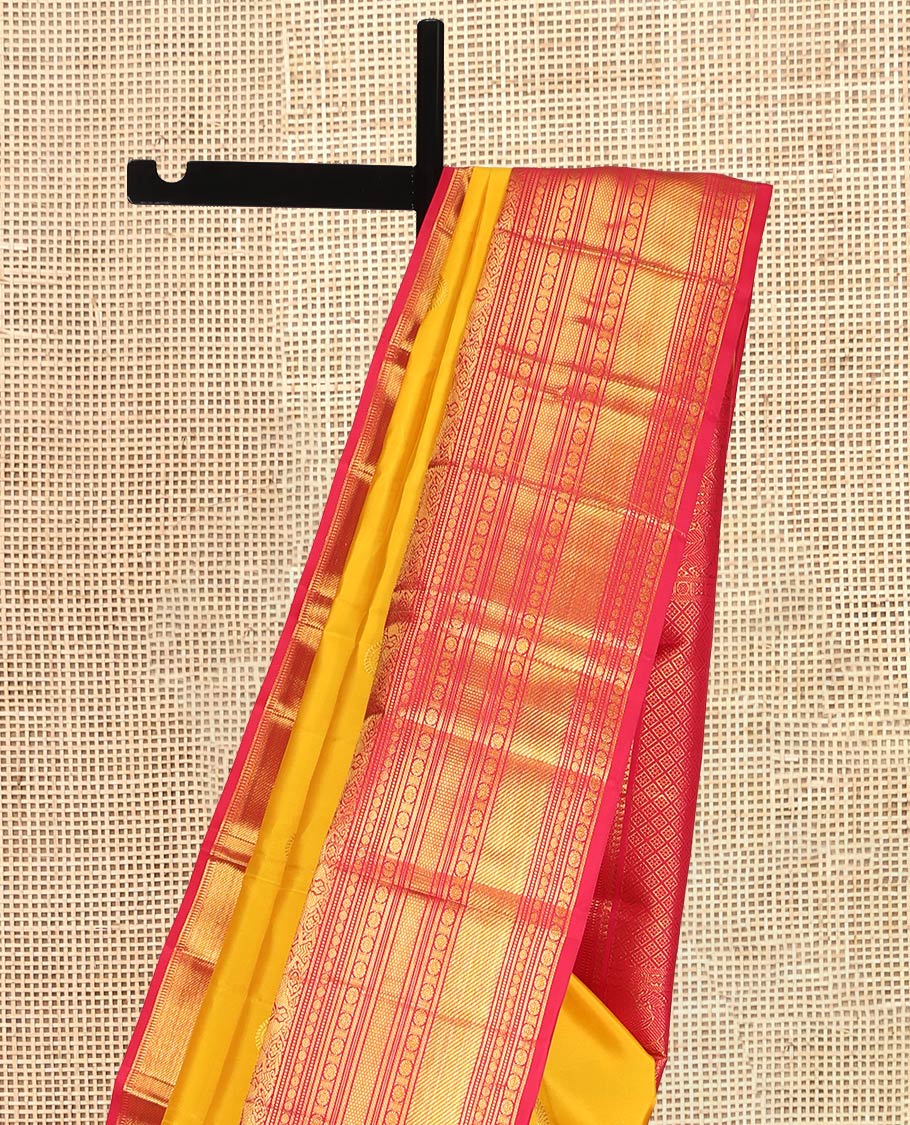 Yellow Kanchipuram Silk Saree, Embellished with Manga Buttas, a Contrast Korvai Border of Thilakam Mokku, Chakram, Then Kuli Kann, Kuthirai, and Poun Designs, Jaal Pallu, and a Contrast Blouse