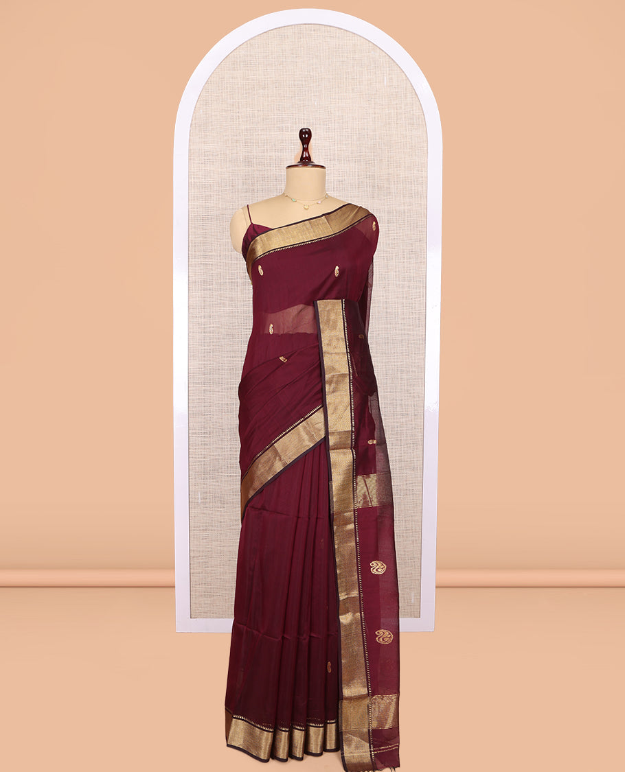 Maroon Maheshwari Cotton Saree, Adorned with Buttas, Highlighted by a Traditional Zari Border, Pallu Gleamed Up with Zari Buttas, and a Matching Blouse