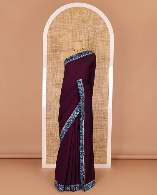 Wine plain Vichitra silk saree, contrast bandhani printed with Swarovski micro-stonework border, and a contrast bandhani printed blouse