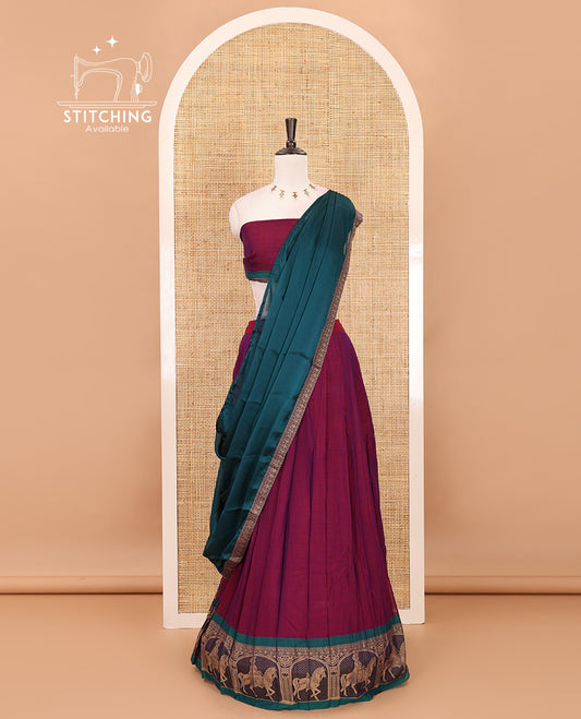 Magenta with green mercedised cotton half-saree, contrast elephant zari border skirt, matching blouse & one side border georgette dhavani