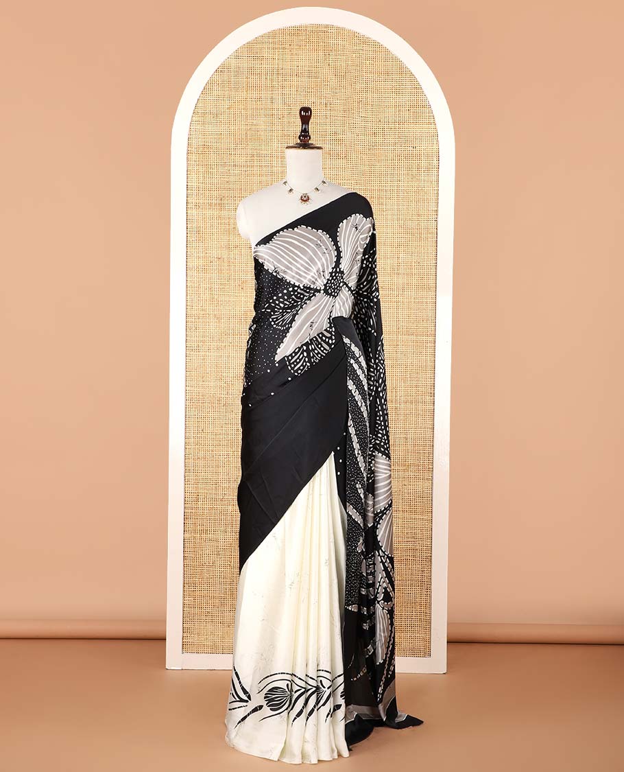 Borderless black half-and-half model satin saree with batik-style big floral motifs digital printed body and pallu