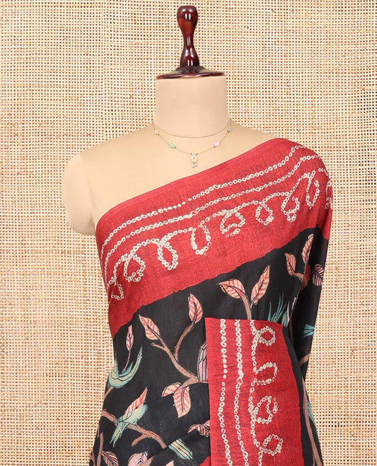 Black Fancy Tussar Saree Features Kalamkari Floral and Animal Print, Contrast Bandhani Border, Bandhani Pallu, and a Contrast Blouse