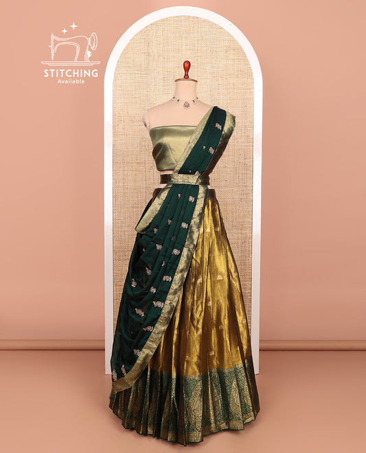Gold-dark green zari buttas half-saree with contrast Mughal-style paisley motifs woven bordered skirt, brocade blouse, and a zari design dhavani