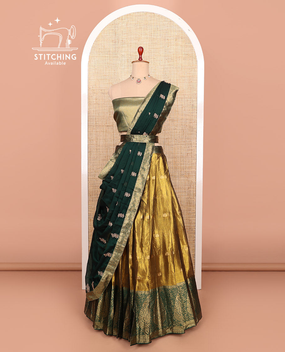 Gold-dark green zari buttas half-saree with contrast Mughal-style paisley motifs woven bordered skirt, brocade blouse, and a zari design dhavani