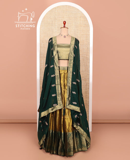 Gold-dark green zari buttas half-saree with contrast Mughal-style paisley motifs woven bordered skirt, brocade blouse, and a zari design dhavani