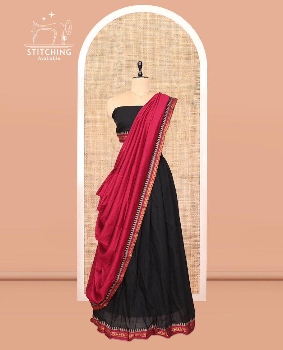 Black Cotton Half-Saree Features Plain Skirt, a Contrast Traditional Border, a Matching Blouse, and a Contrast Dhavani