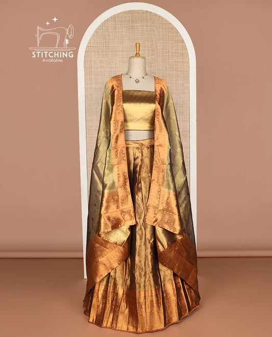 Brown ogee design tissue half saree with contrast zari design border, floral design blouse & floral design dhavani