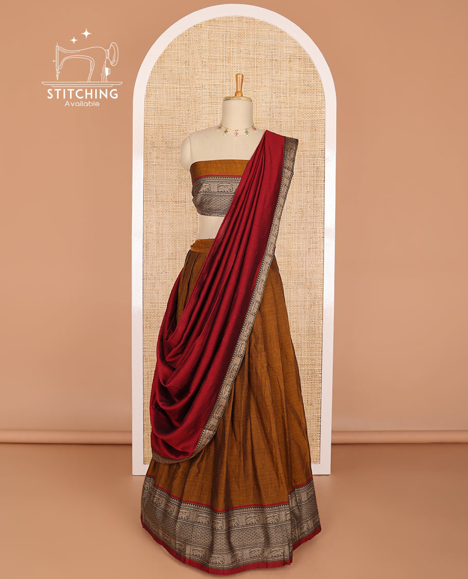Brown cotton half saree with contrast elephant motifs border, elephant design blouse & elephant design border dhavani