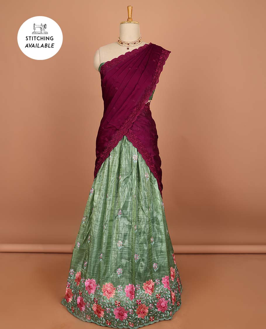 Green buttas half saree with contrast border , zari design blouse & floral buttas , scallop border dhavani