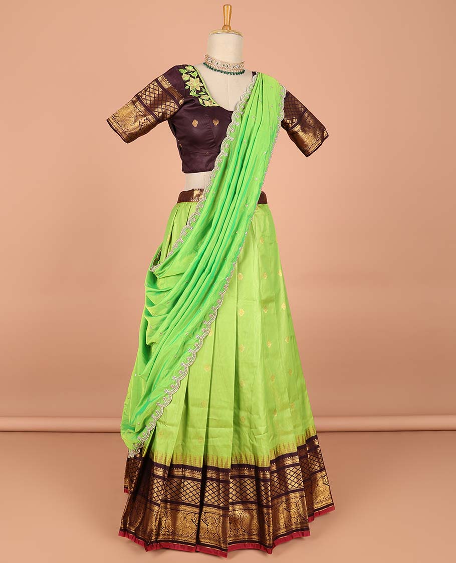 Green buttas semi-stitched half saree with contrast zari border,  embroidered blouse & scallop border dhavani