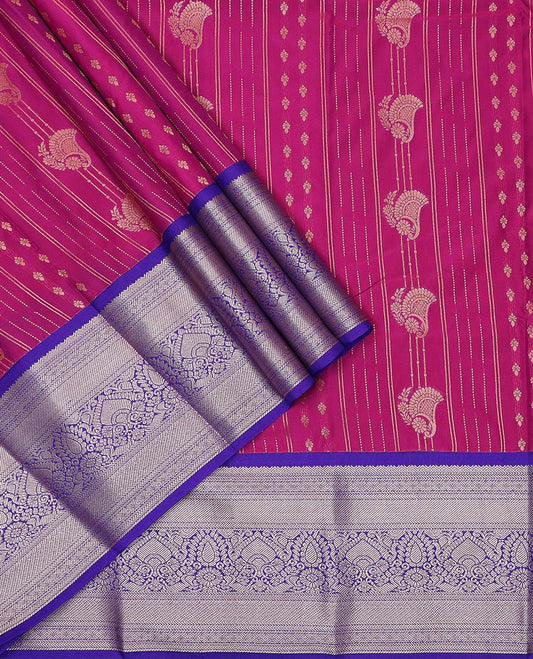 Magenta art silk pavadai material, zari design with contrast traditional zari border skirt, a contrast bordered blouse