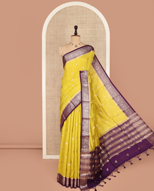 Yellow Assam Silk Saree Prettified with Zari Buttas on Its Body, Complemented by a Contrast Traditional Zari Design Border, a Vibrant Pallu of Zari Stripes, and Paired with a Contrast Blouse