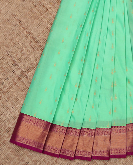 Green Budget Silk Saree, Elevated with Zari Buttas All Over Its Body, Complemented by a Contrast Traditional Peacock-Chakram Zari Border, Grand Butta Enclosed Checked Pallu, and Paired with a Contrast Blouse