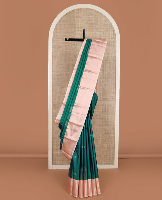 Green zari buttas gift saree, contrast traditional zari design border, and chevron striped pallu