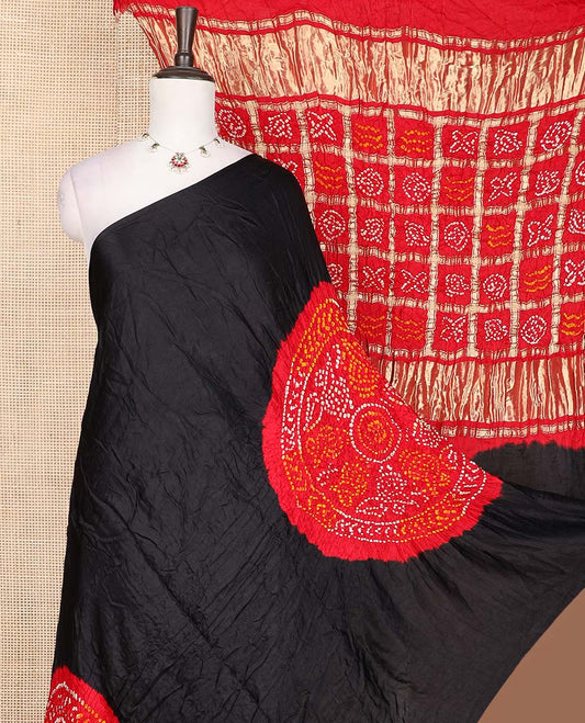 Borderless black dots enclosed big circle motifs bandhani silk saree, butta enclosed thick zari checked gharchola pallu