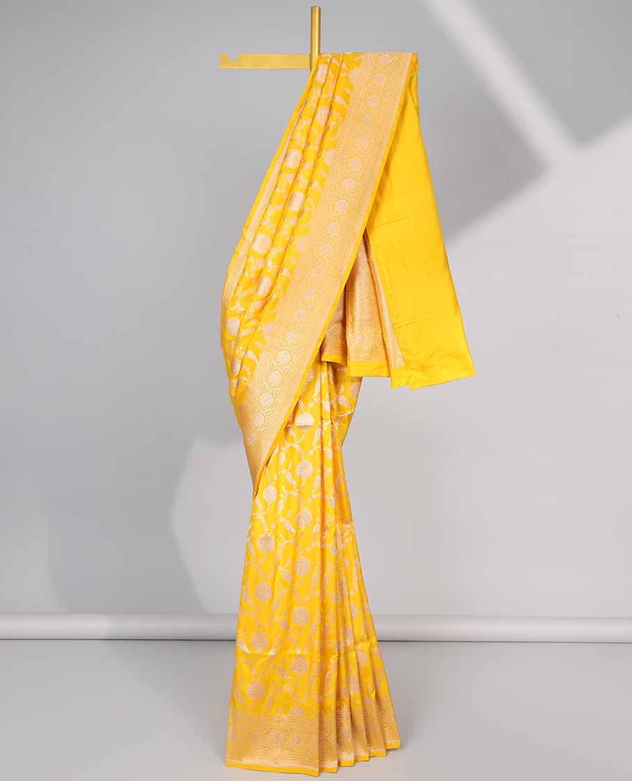 Yellow floral jacquard banaras silk saree with self intricate zari border & floral zari design pallu