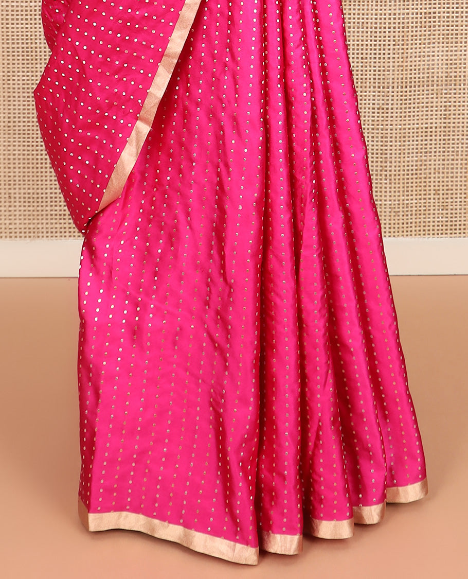 Bright pink dobbly style dotted banarasi silk saree, piping zari border, and chevron striped pallu