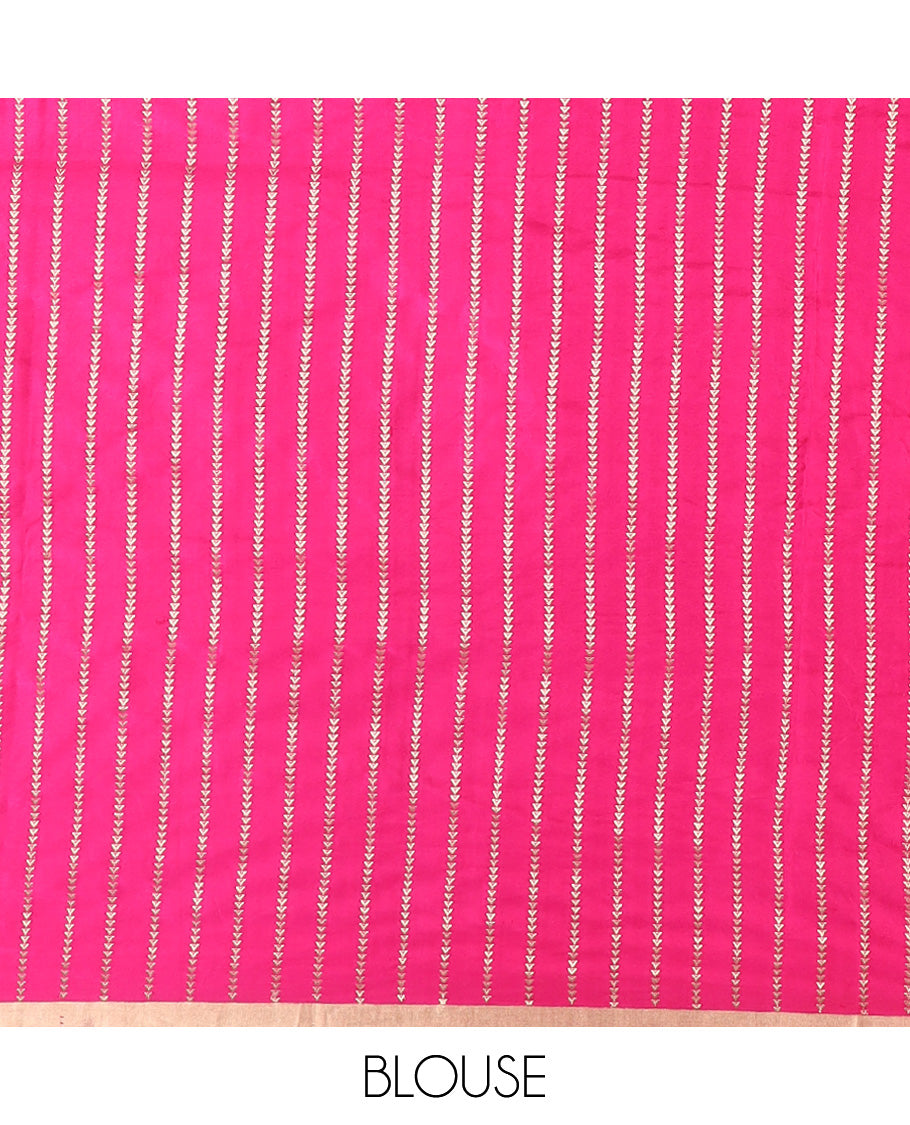 Bright pink dobbly style dotted banarasi silk saree, piping zari border, and chevron striped pallu