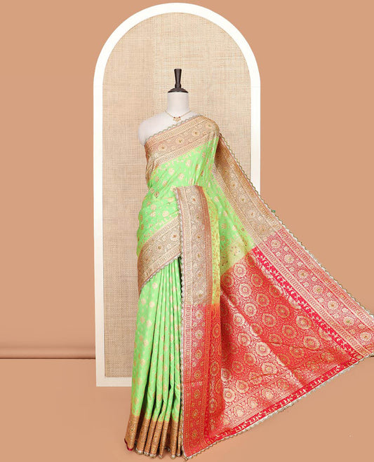 Green buttas and stone work banarasi silk saree, contrast traditional zari and stone work lace border, and pallu of intricate designs and stone work
