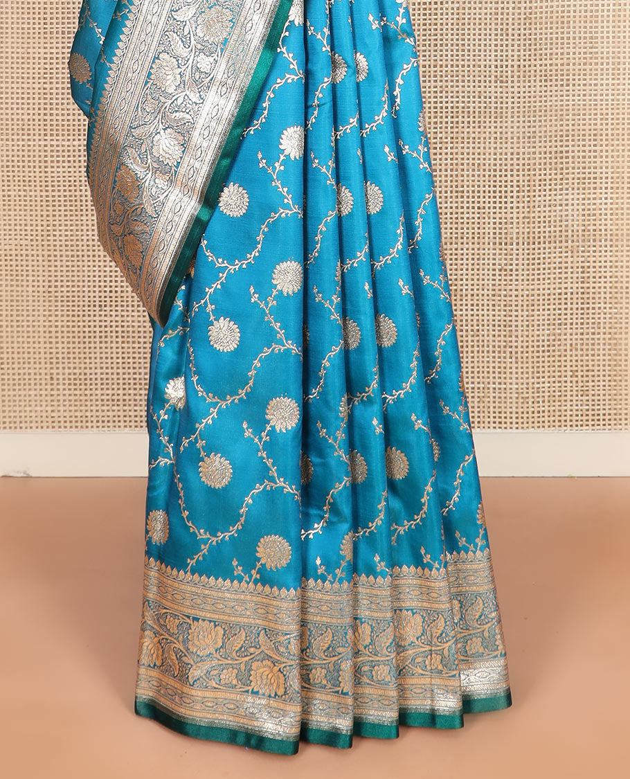 Light blue floral jaal jacquard banarasi silk saree, floral creeper design border, and intricate ogee patterned pallu