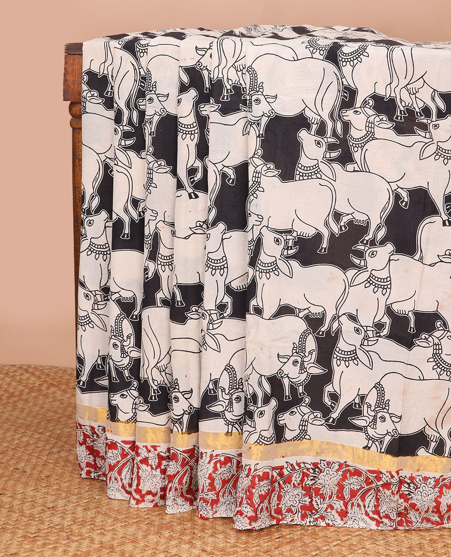 Black pichwai design machine printed kalamkari cotton saree with contrast floral design border & floral, peacock design pallu