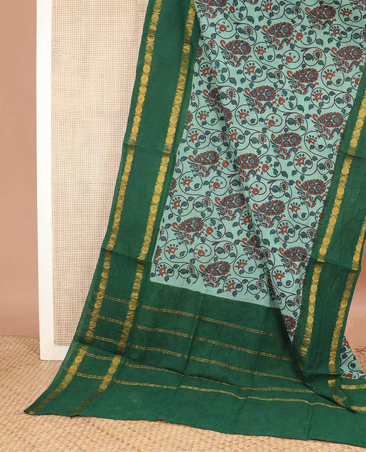 Green kalamkari style floral vine and peacock printed sungudi cotton saree, contrast rettai pettu rudraksham border, and zari striped pallu