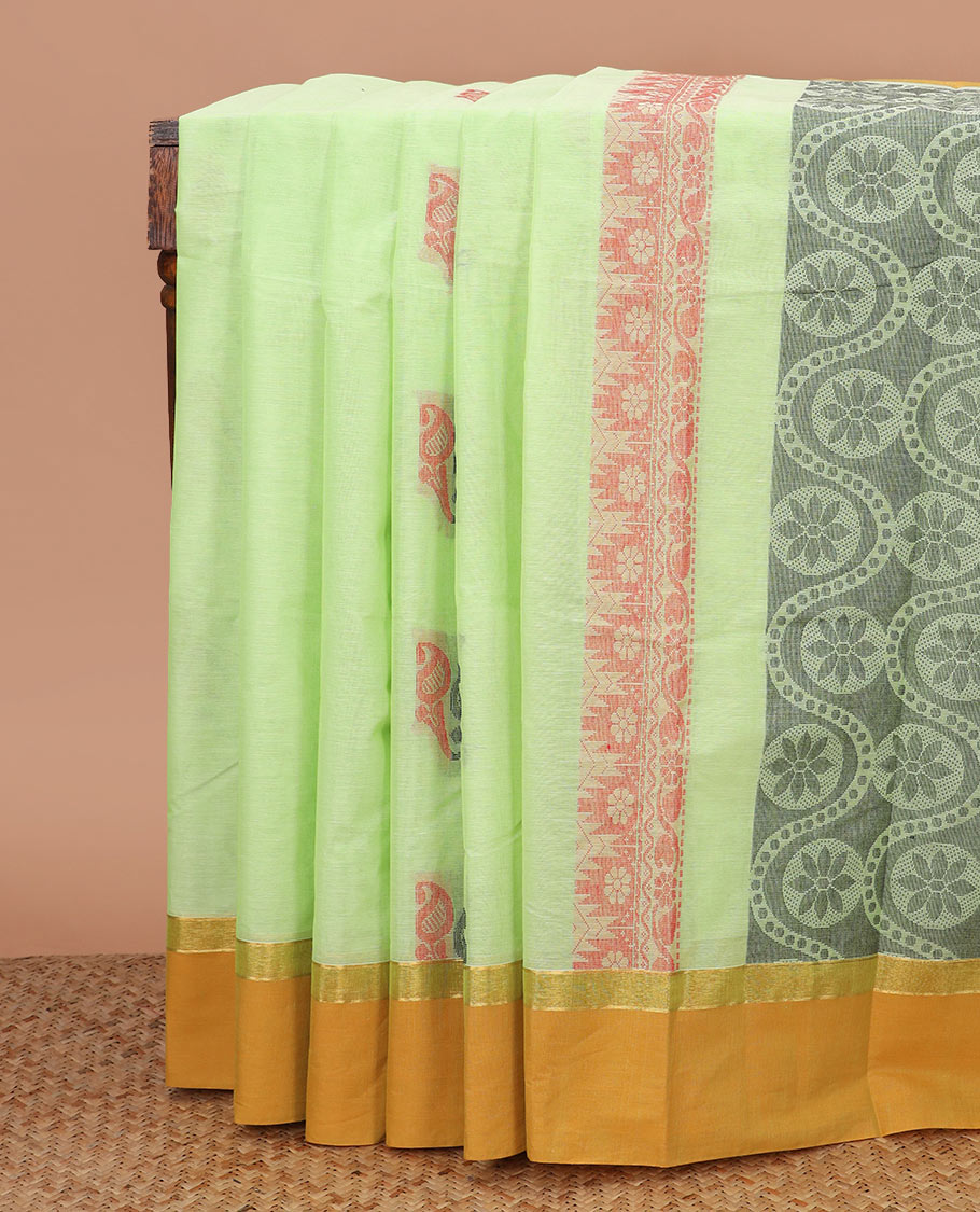Pista green paisley buttas kanchi cotton saree, contrast plain border, and chakram design pallu