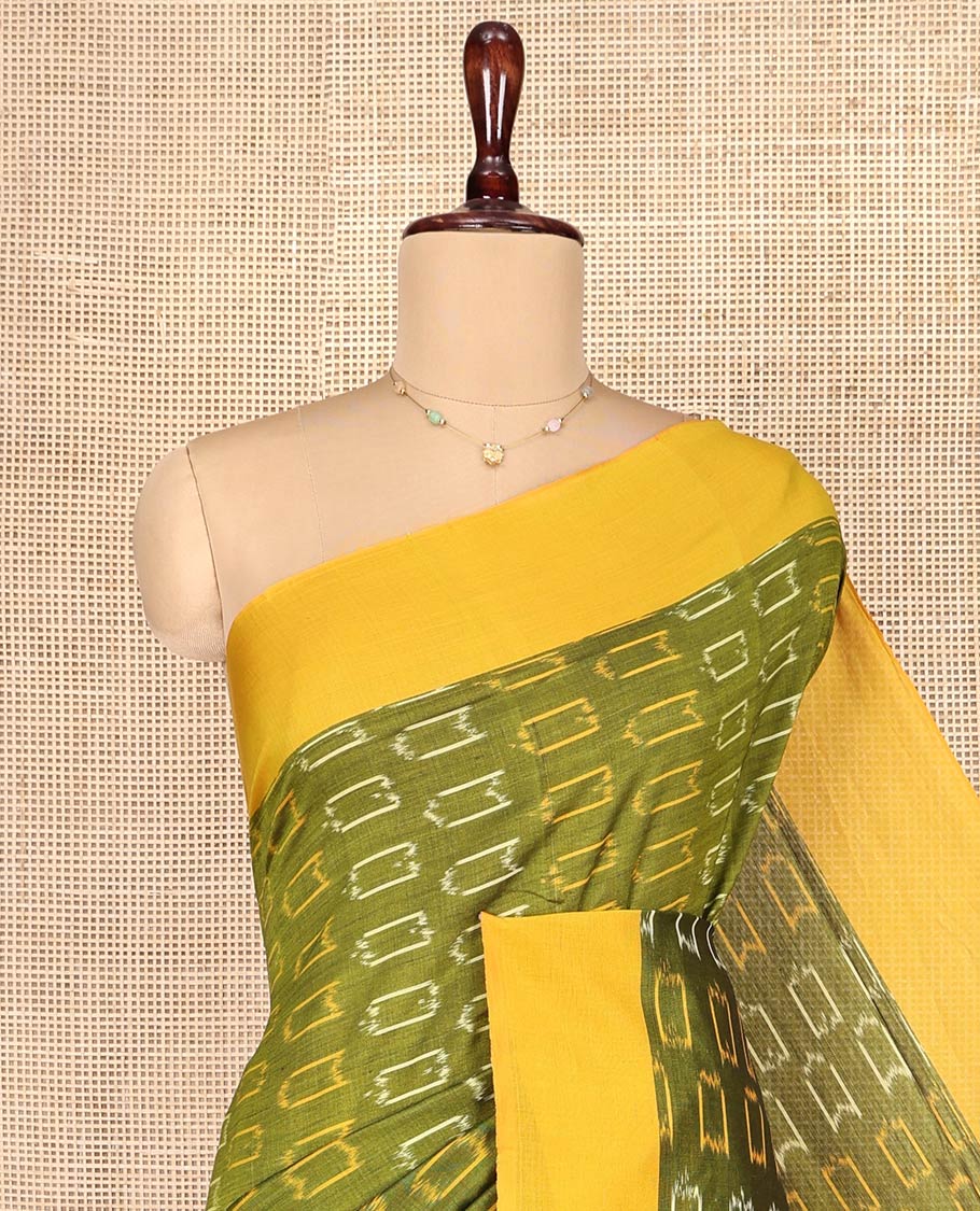 Green Ikkat Cotton Saree, Embellished with Ikkat-Style Buttas on Its Body, Complemented by Contrast Border, Pallu Steeped with Ikkat Buttas, and Has No Blouse
